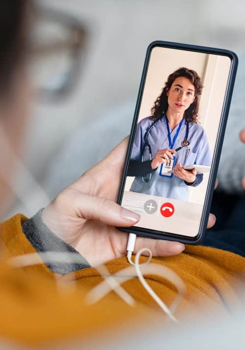 Patient on a video call with nurse